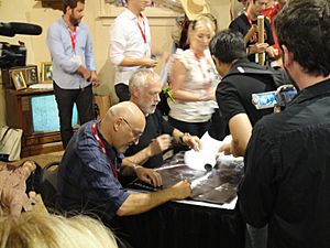 Comic-Con 2010 - Frank Darabont and Drew Struzan sign the limited edition Walking Dead poster