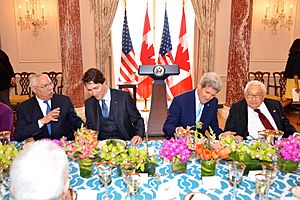 Former Secretary Powell, Canadian Prime Minister Trudeau, Secretary Kerry, and Former Secretary Kissinger Chat at the State Luncheon in Honor of the Prime Minister (25050276164)