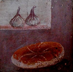 Two figs and a loaf of bread, the most modest and frugal of foods - wall painting from Herculaneum, buried by Vesuvius' eruption on 79 AD (38846553561)