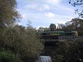 A goods train crosses a minor tributary of the Thames on its way towards Oxford Station - geograph.org.uk - 1555200