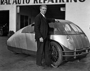 Calvin B. Bridges with his newly designed automobile.jpg