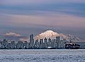Mount Baker behind the towers of Vancouver in May 2022