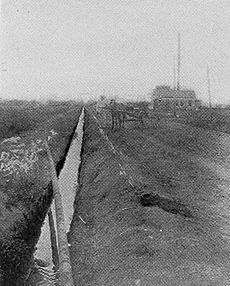 Oil flowing through an open ditch in Texas (1911)