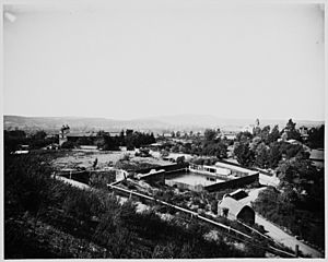 View of Mission Santa Barbara and surrounding grounds from a distant hill to the north, ca.1898 (CHS-12079)