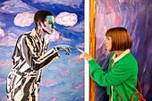Alexa Meade painted model interacting with a guest at the Wonderland Dreams Exhibition