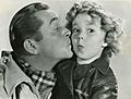 James Dunn and Shirley Temple publicity photo for "Bright Eyes" - front (cropped)