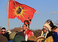 Native American speaker with his father and a drum