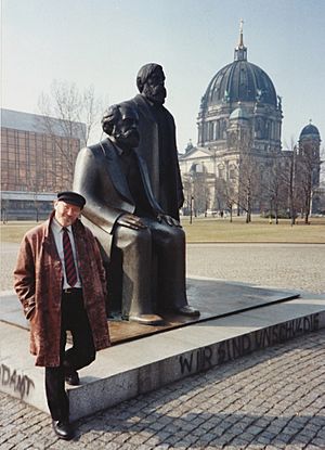 Oestreicher by Marx and Engels statue Berlin