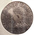 Two dogs in the water around the reflect of a crown 1627