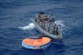 US Navy 090906-N-5231R-055 Members of U.S. Joint Special Operations Task Force - Philippines (JSOTF-P) check life rafts for survivors Sept. 6, 2009 following the sinking of a Philippine super ferry