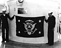 Crewmen aboard USS Indianapolis (CA-35) display the U.S. Presidential Flag, in late November 1936 (NH 68040)