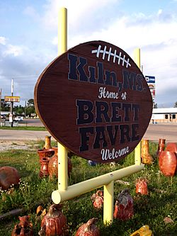 A football-shaped city welcome sign in honor of notable former resident Brett Favre