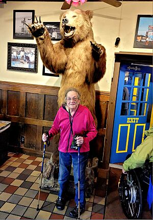 Taxidermied grizzly bear and customer