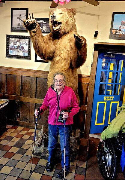 Taxidermied grizzly bear and customer