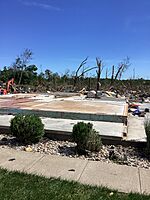 EF4 damage: This strong house was completely flattened into a pile of debris.