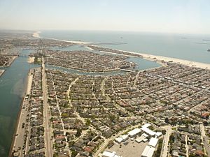 Naples Island is in the middle distance in this photo, with Belmont Park in the foreground, Belmont Shore to the right, and The Peninsula and the neighboring city of Seal Beach beyond, looking southeast.