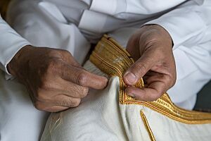 Bisht Being Sewn