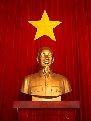 Ho Chi Minh statue and flag of Vietnam