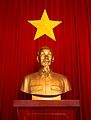 Ho Chi Minh statue and flag of Vietnam