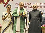 Mohd. Hamid Ansari presented the Dadasaheb Phalke Award 2011 to Shri Soumitra Chatterjee, at the 59th National Film Awards function, in New Delhi. The Union Minister for Information and Broadcasting, Smt. Ambika Soni (cropped).jpg