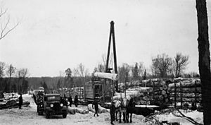 Photograph of a Gasoline Jammer Loading Logs on Car - NARA - 2127627