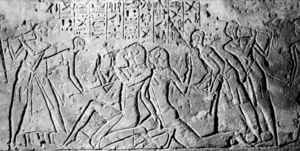 Ancient carving - Shasu spies being beaten by Egyptians