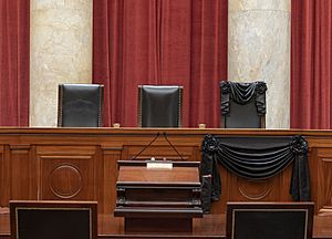Associate Justice Ruth Bader Ginsburg’s chair and the bench in front of her seat at the Supreme Court draped in black