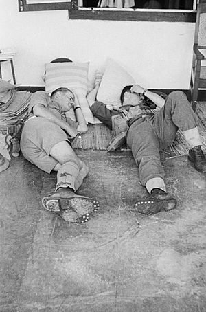 Australian soldiers resting during the Battle of Leuwiliang