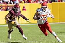 Cole Holcomb chasing Travis Kelce OCT2021 (cropped)