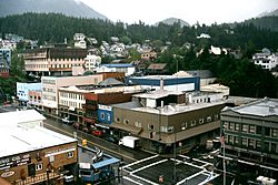 View from a cruise ship of downtown Ketchikan in May 2002.  In the foreground is the intersection of Dock and Front streets.  The Tongass Trading Company, which anchors the intersection, has operated in Ketchikan since 1898.
