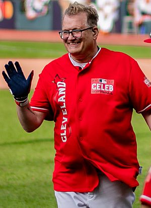 Carey smiling in a celebrity baseball game