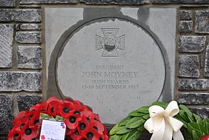 Facing plaque on the memorial to John Moyney, V.C, on Mill Road, Rathdowney, co. Laois