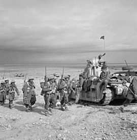 Infantry of the 2nd New Zealand Division link up with Matilda tanks of the Tobruk garrison during Operation 'Crusader', Libya, 2 December 1941. E6918