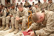 Marines pray in camp chapel during memorial service for Corporal Ramona Valdez, 2005
