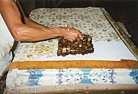Printing wax-resin resist for Batik with a Tjap, Yogyakarta, 1996