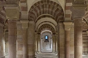 A great hall with a high arched ceiling braced with columns