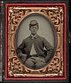 Three quarter portrait, young Civil War soldier in kepi. Cased tintype, ninth plate
