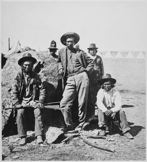Warm Spring scouts, Lava Beds, California, their leader, Donald McKay, is leaning against rock, 1873 - NARA - 533246