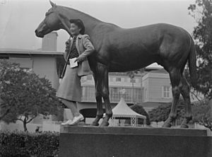 Arcadia, California. Mrs. Lily Okuru poses with statue of "Seabiscuit" in Santa Anita Park, now an . . . - NARA - 537056 (cropped)