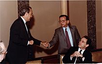 Bob Dole shaking hands with Ted Stevens