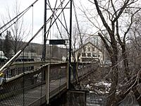 Footbridge crossing Lamoille River Main Street Hardwick VT March 2013