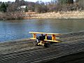 Model plane by a lake
