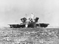 USS Essex (CV-9) is hit by a Kamikaze off the Philippines on 25 November 1944