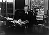 Calvin Coolidge seated at desk in Oval Office LOC3b39484r.jpg