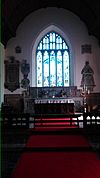 Chancel, looking towards the altar and the great east window, St Padarn's Church, Llanbadarn Fawr.jpg