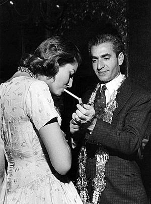 Shah lighting cigarette for his wife Sorraya