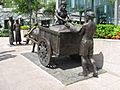 The River Merchants (2003) by Aw Tee Hong, Cavenagh Bridge, Singapore - 20060530