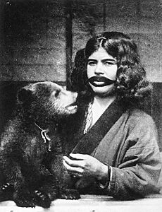 Ainu woman with mouth tattoos and live bear