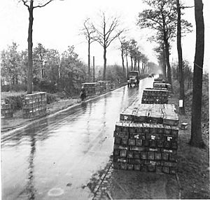 Ammunition piled up alongside the road from where they are collected by Units