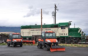 Locomotive and other vehicles near Island Avenue